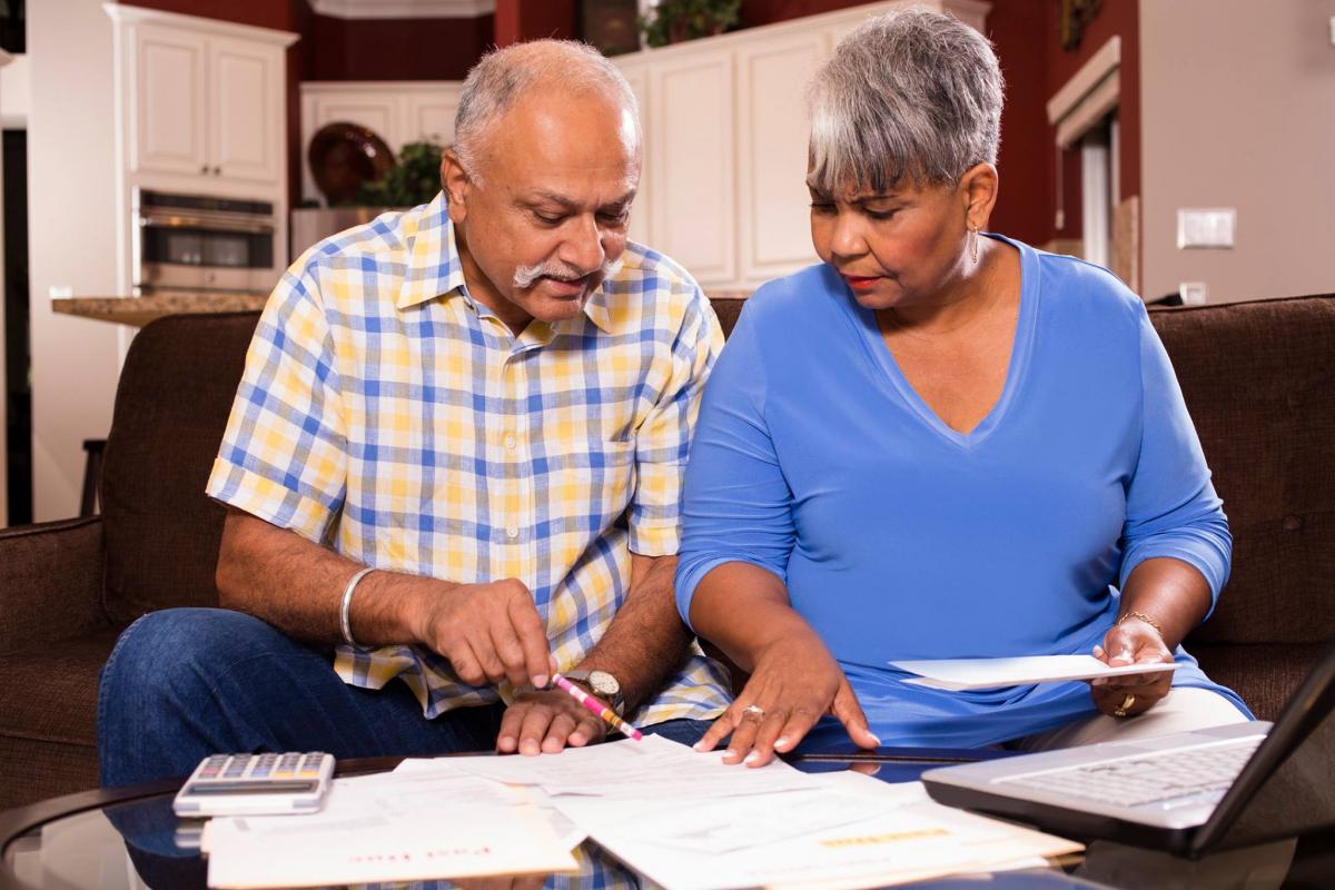 Senior couple looking at paperwork together